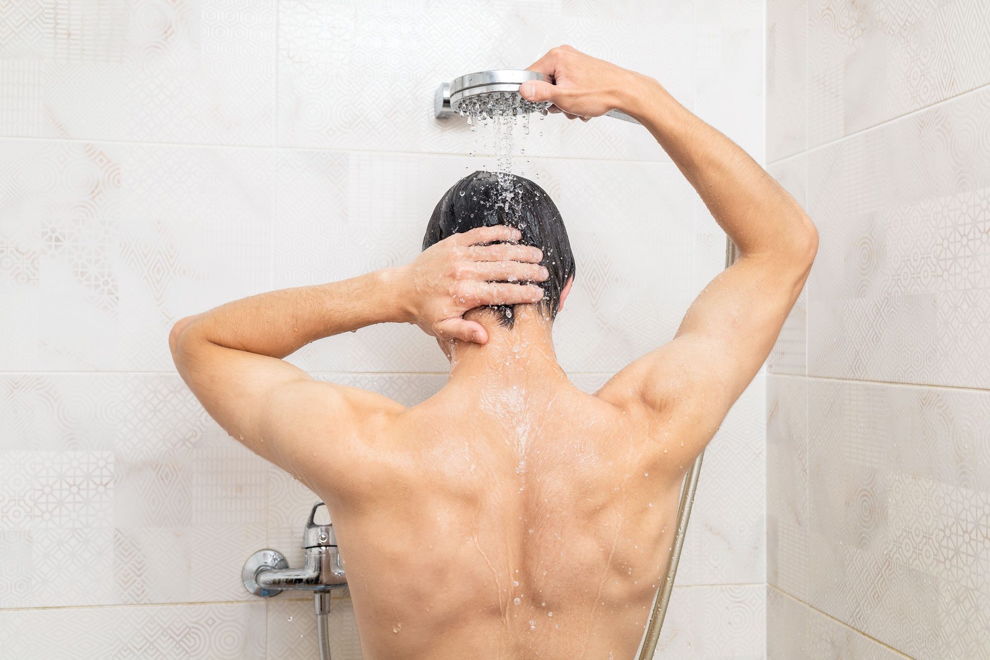 https://www.rd.com/wp-content/uploads/2011/06/Man-Taking-A-Shower-GettyImages-1603522403_KSedit.jpg