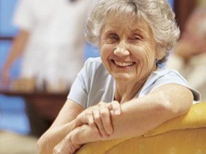 senior woman smiling on couch