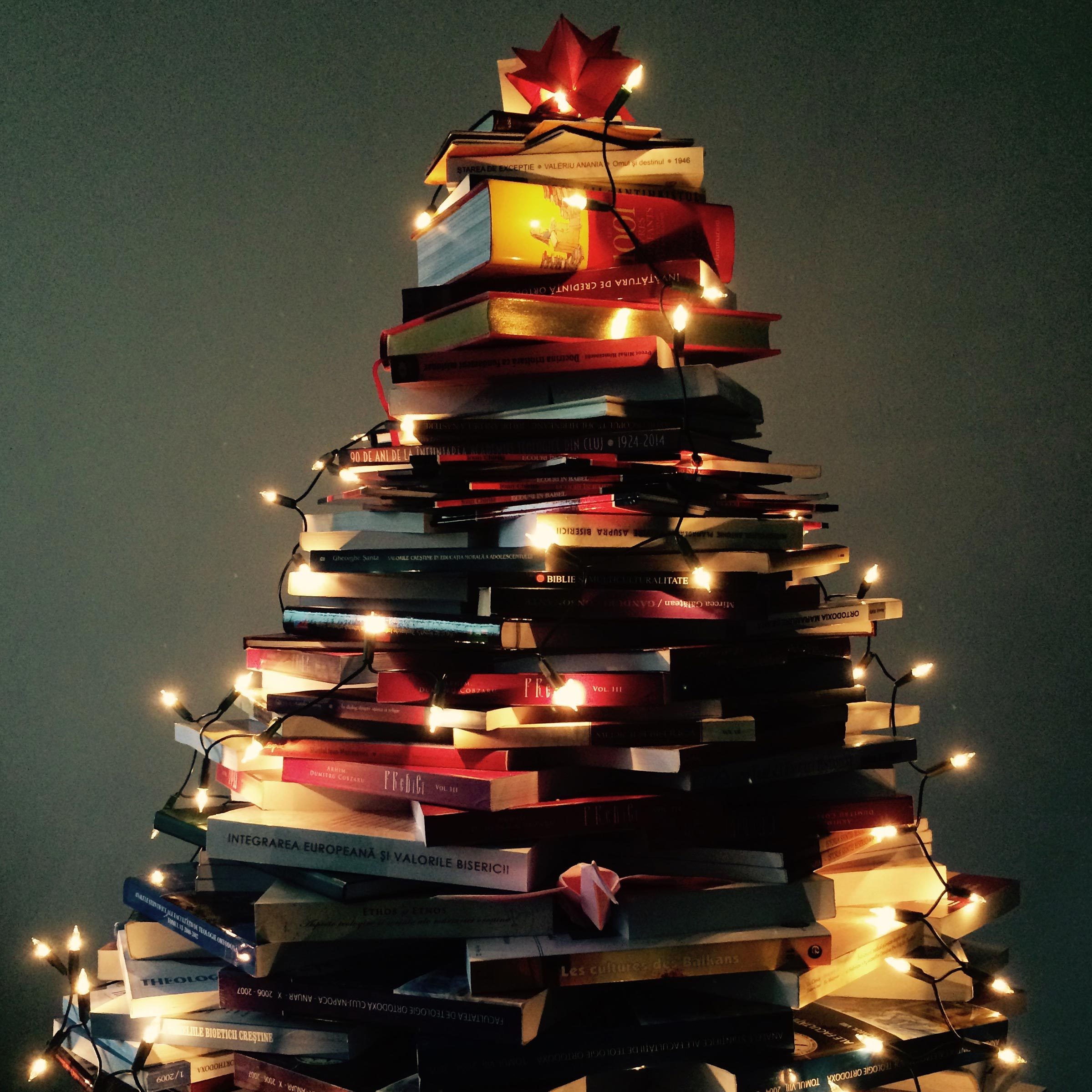 Christmas tree constructed from pile of books