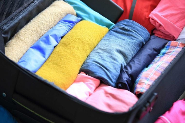 how to pack clothes in small suitcase