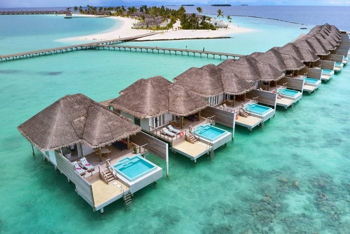 over the water bungalows on turquoise clear water at Sun Siyam Iru Veli