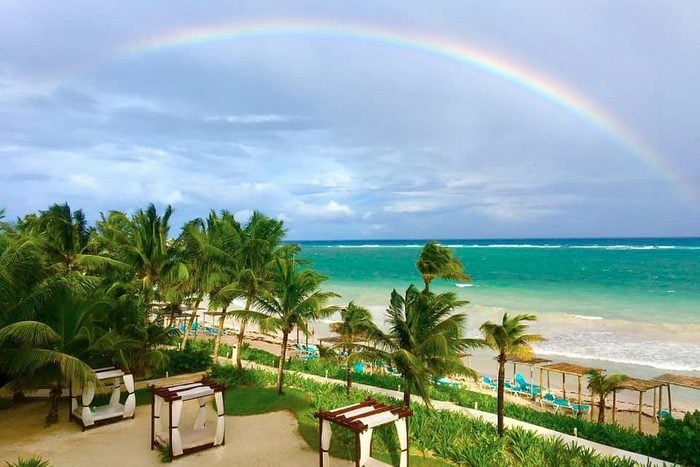 rainbow over beach resort at Akumal bay beach and wellness resort