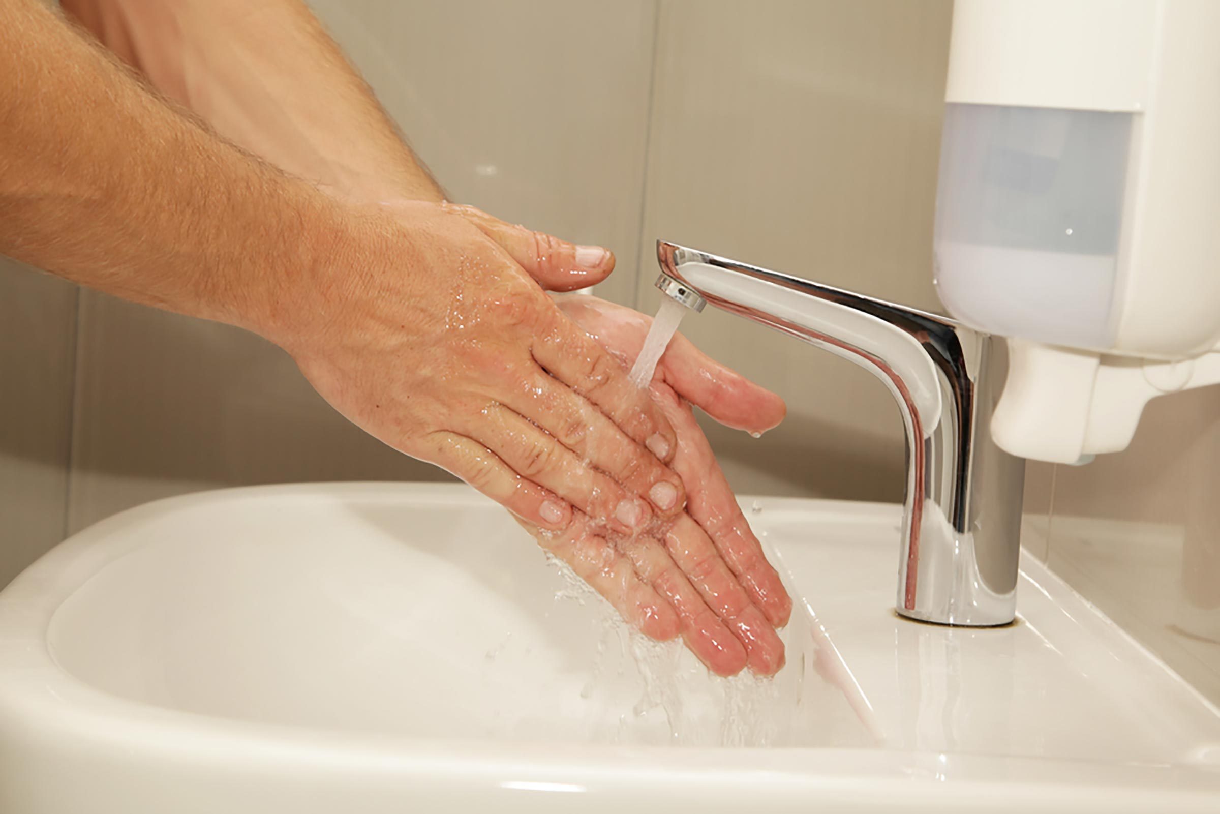 washing hands in kitchen sink or bathroom sink