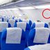 What Those Triangle Stickers Above Your Airplane Seat Really Mean