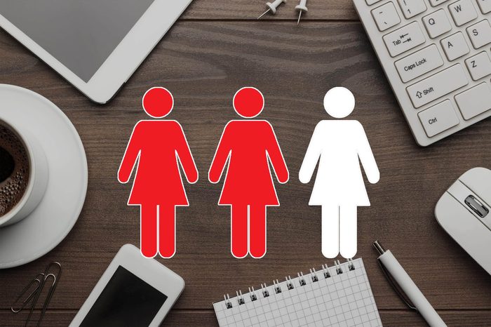 overhead close up of wooden desk with keyboard, mouse, notebook, tablet, phone, coffee with women symbols overlay