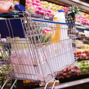 woman shopping cart in supermarket