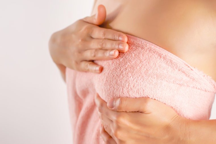 Woman Wearing A Pink Strapless Checking Her Breast, Breast Self-Exam (BSE), How do I check breast concept, Breast Cancer Awareness