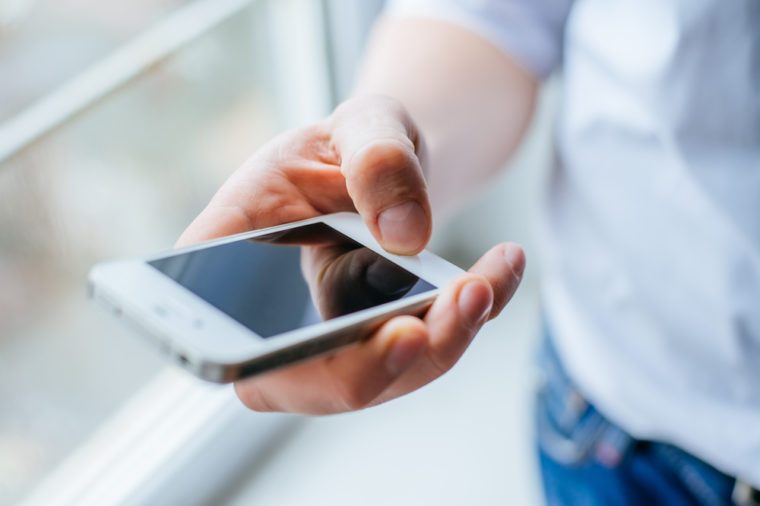 A man uses a smartphone.