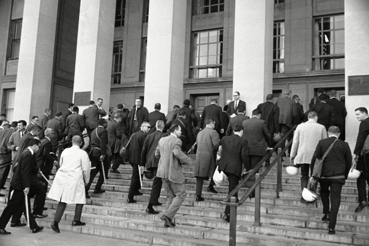 U.S. Marshals carrying night sticks and helmets arrive at the Pentagon in Washington, D.C., . The marshals were ordered to the Pentagon, along with miltary personnel and police, for duty during a planned anti-war demonstration later in the day