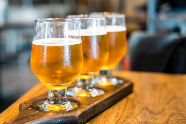   3 cups of draft on a wooden table 