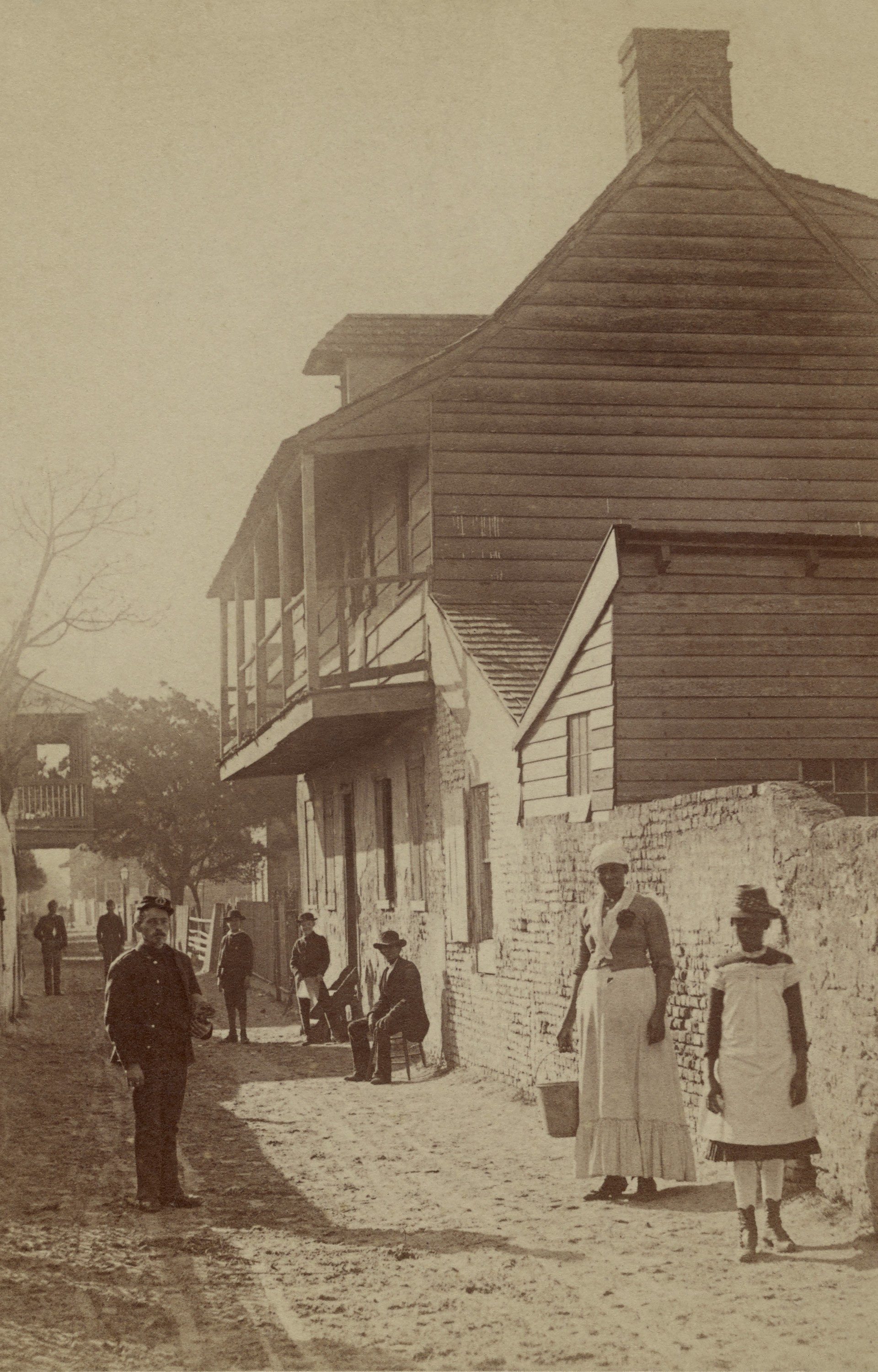 Mandatory Credit: Photo by Everett/Shutterstock (10408919a) Street scene with a soldier, two African American women, and others in St. Augustine, Florida, 1886. Photo by George Barker