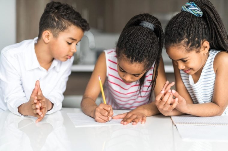 Child write note on the kitchen table