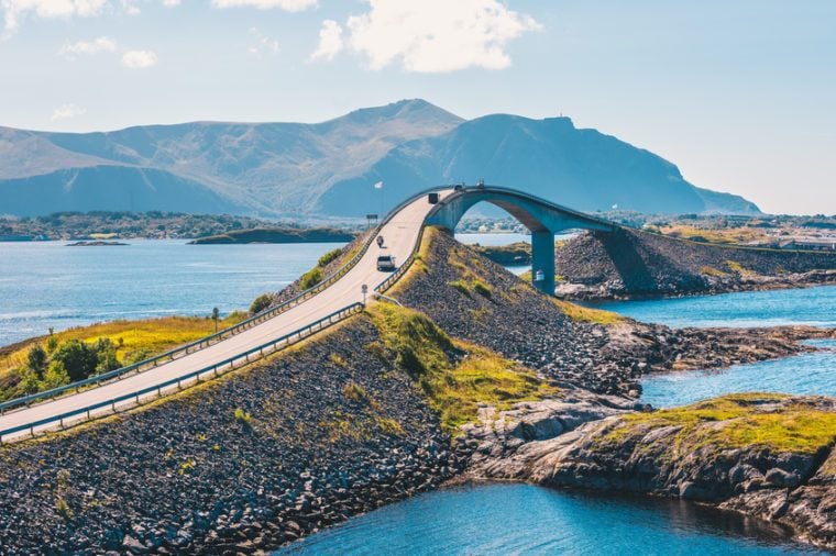 World famous Atlantic road bridge (Atlanterhavsvegen) with an amazing view over the norwegian mountains. Atlantic road runs through an archipelago in Eide and Averøy in Møre og Romsdal, Norway.