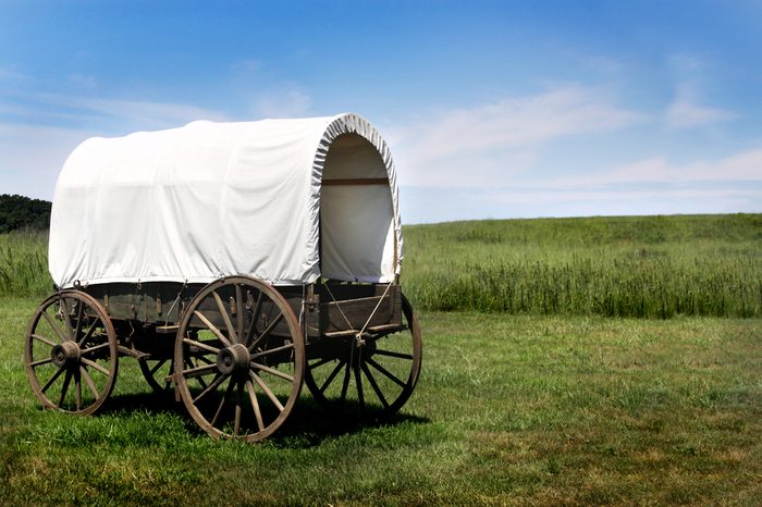 A pioneer covered wagon on the Prairie.