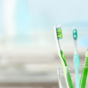 Toothbrushes in glass on blurred background; Shutterstock ID 538821829; Job (TFH, TOH, RD, BNB, CWM, CM): TOH