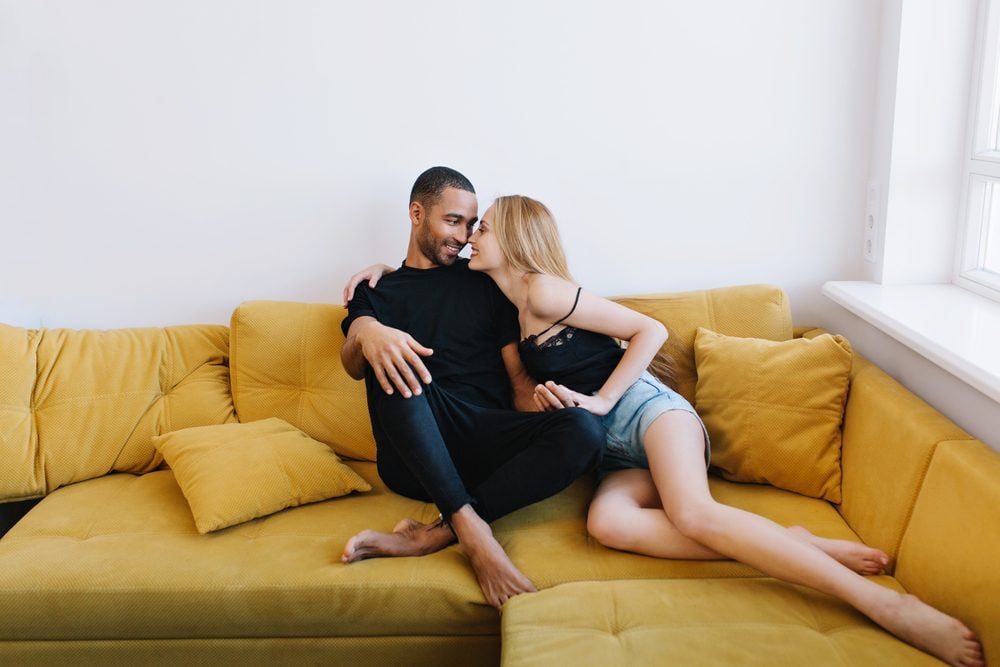 couple on couch in love. Romantic ideas