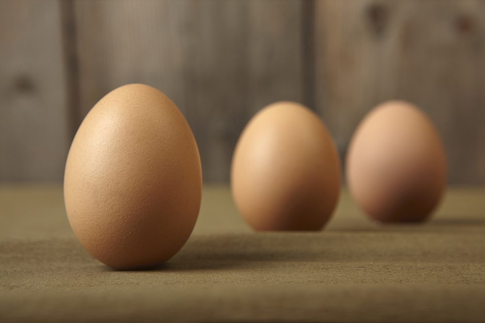 Group of eggs on the kitchen counter.