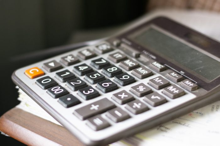 The calculator is placed on the document stack.