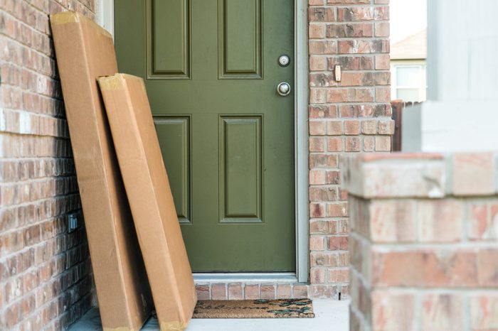 Large packages in cardboard boxes waiting for home owner to come home from work