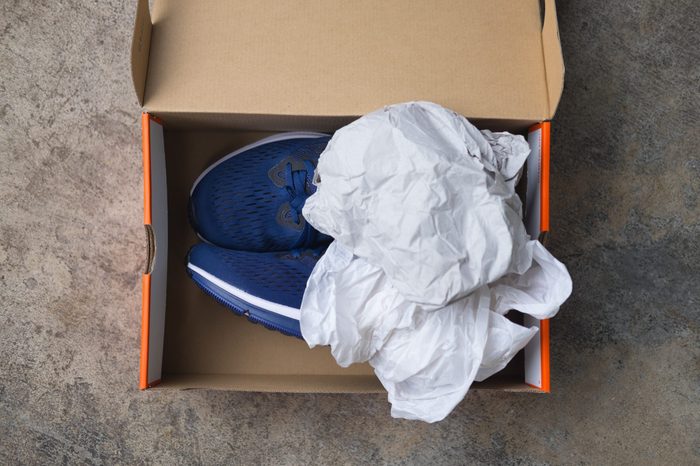 New blue sport shoes in paper box