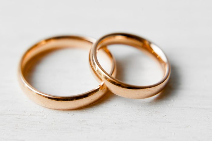 gold engagement rings on white background