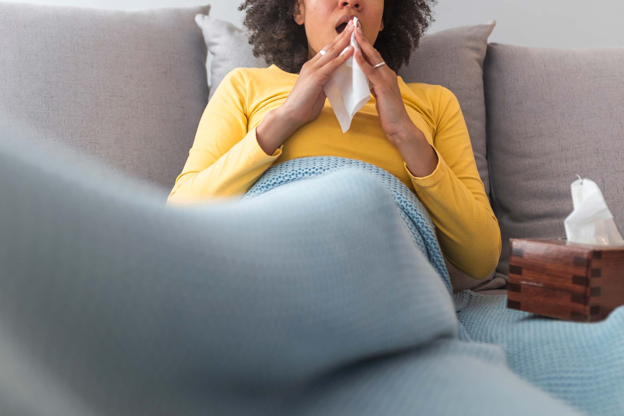 woman sneeze sick