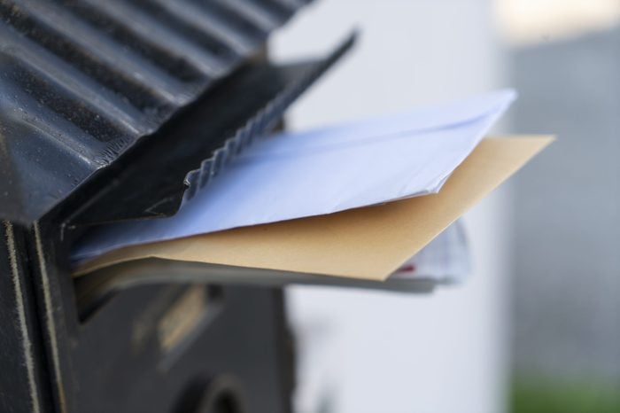 mail sticking out of a letterbox