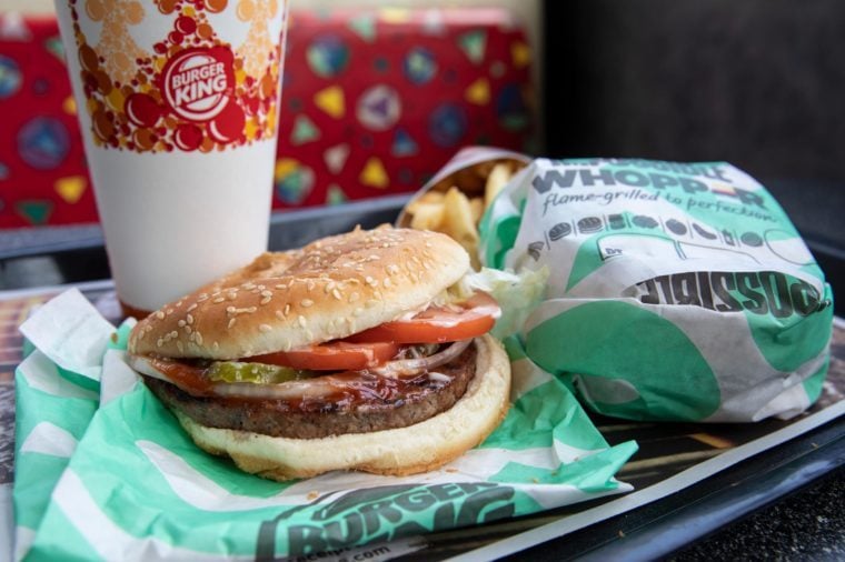 Burger King Impossible Whopper on a tray with fries and a drink