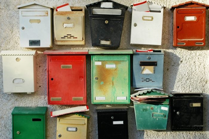 Letter boxes at the entrance of a building with apartments.