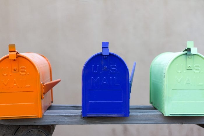 Three colorful mailboxes rural mailboxes.