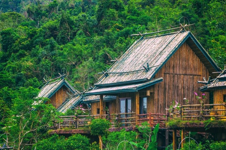 Wooden bamboo house in the jungle. Sanya Li and Miao Village. Hainan, China.