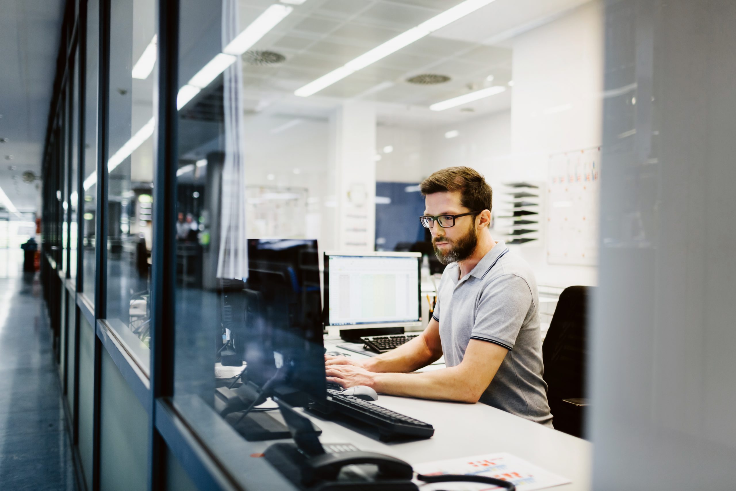 Engineer in control room of a factory