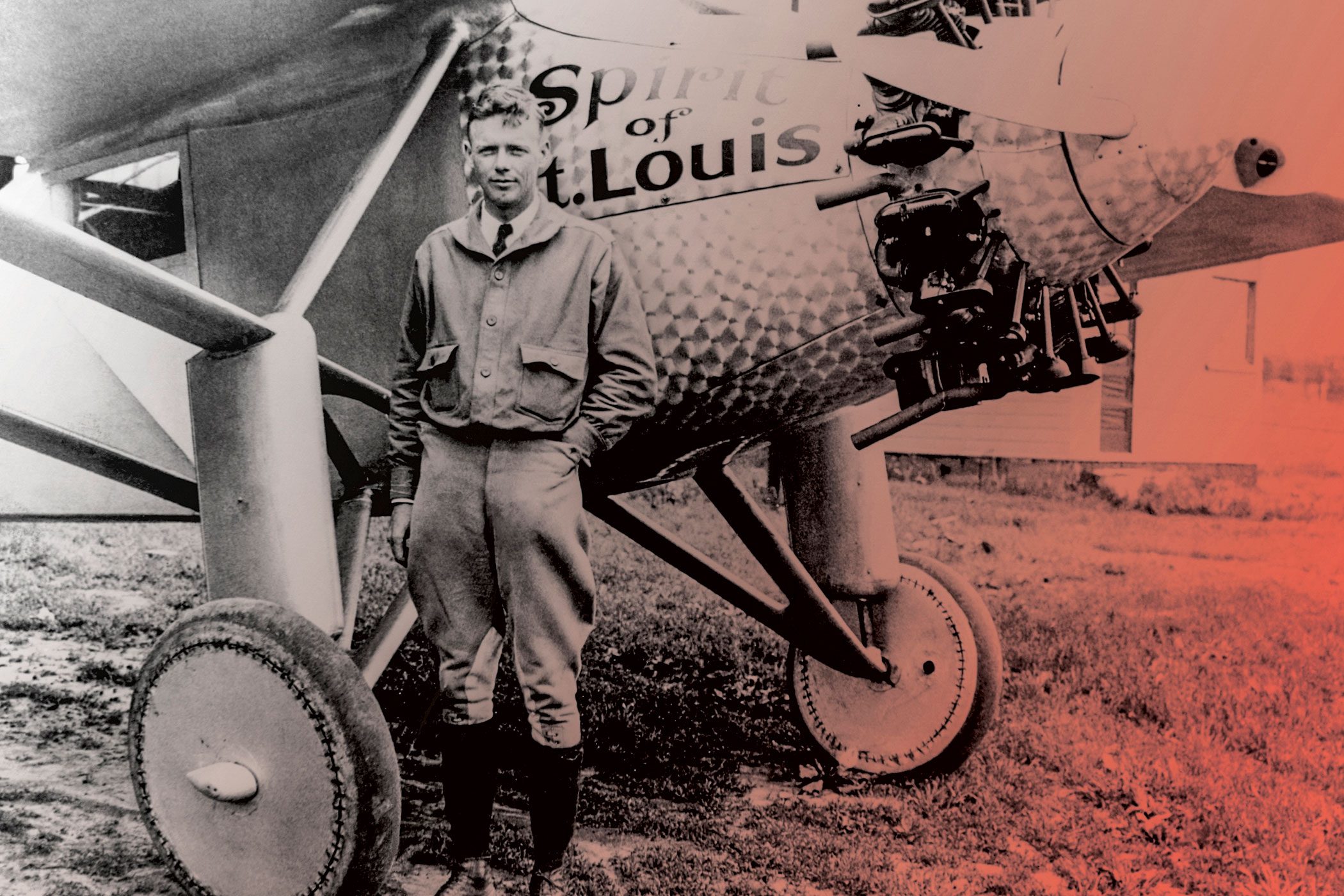 CHARLES LINDBERGH standing in front of the Spirit of St. Louis