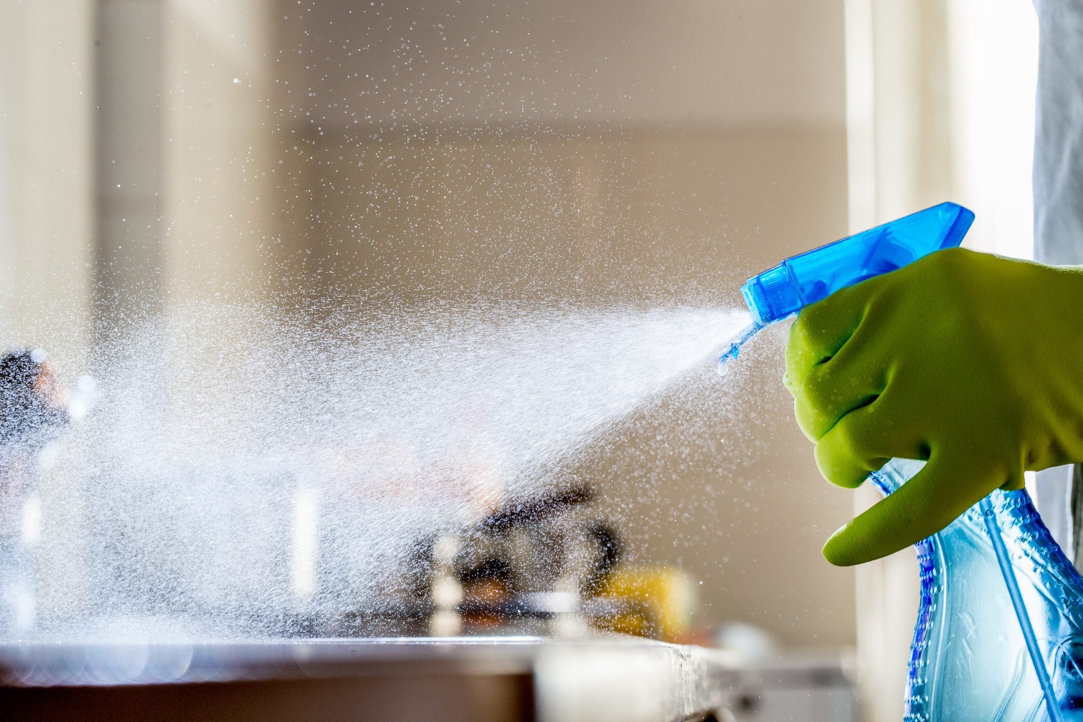 sanitizing kitchen counters and sink with bleach