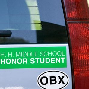 close up on the rear of a car with a two bumper stickers