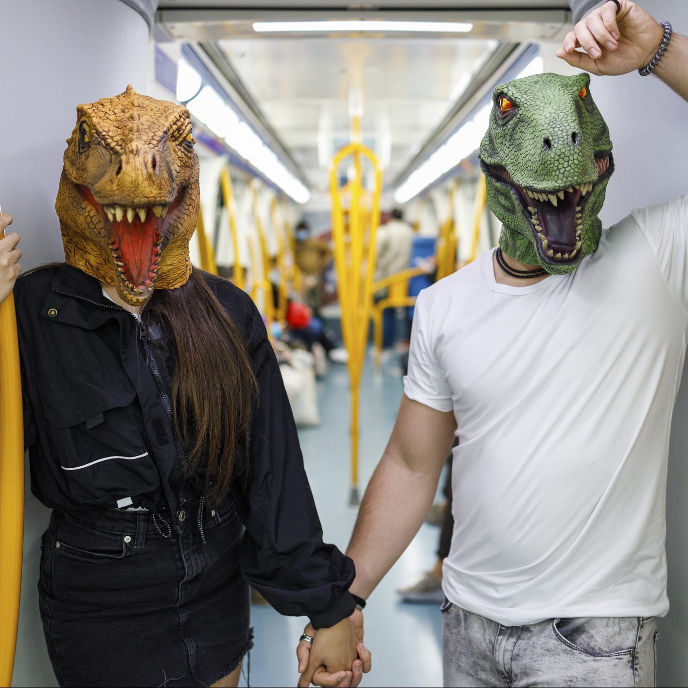 couple dressed as dinosaurs from jurassic park for halloween