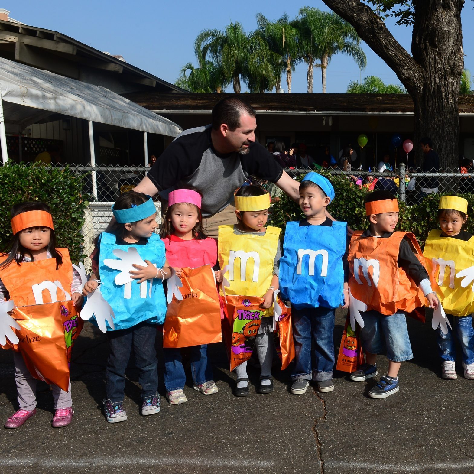 young children dressed up as M&Ms candy for halloween