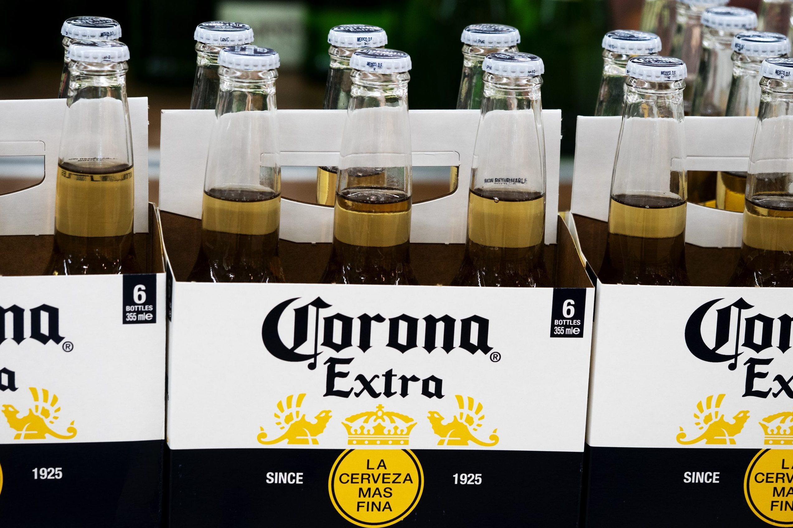 Bottles of Corona Extra beer on a shelf in a store