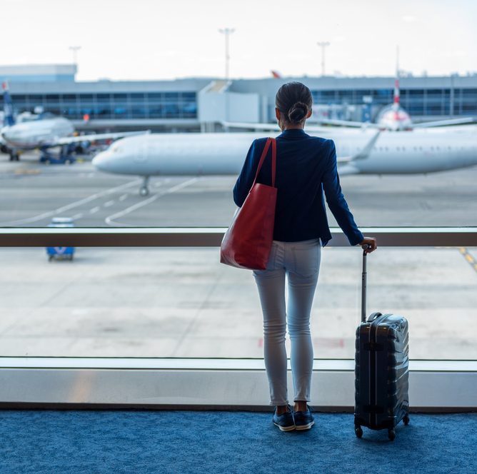 Businesswoman traveling in airport.