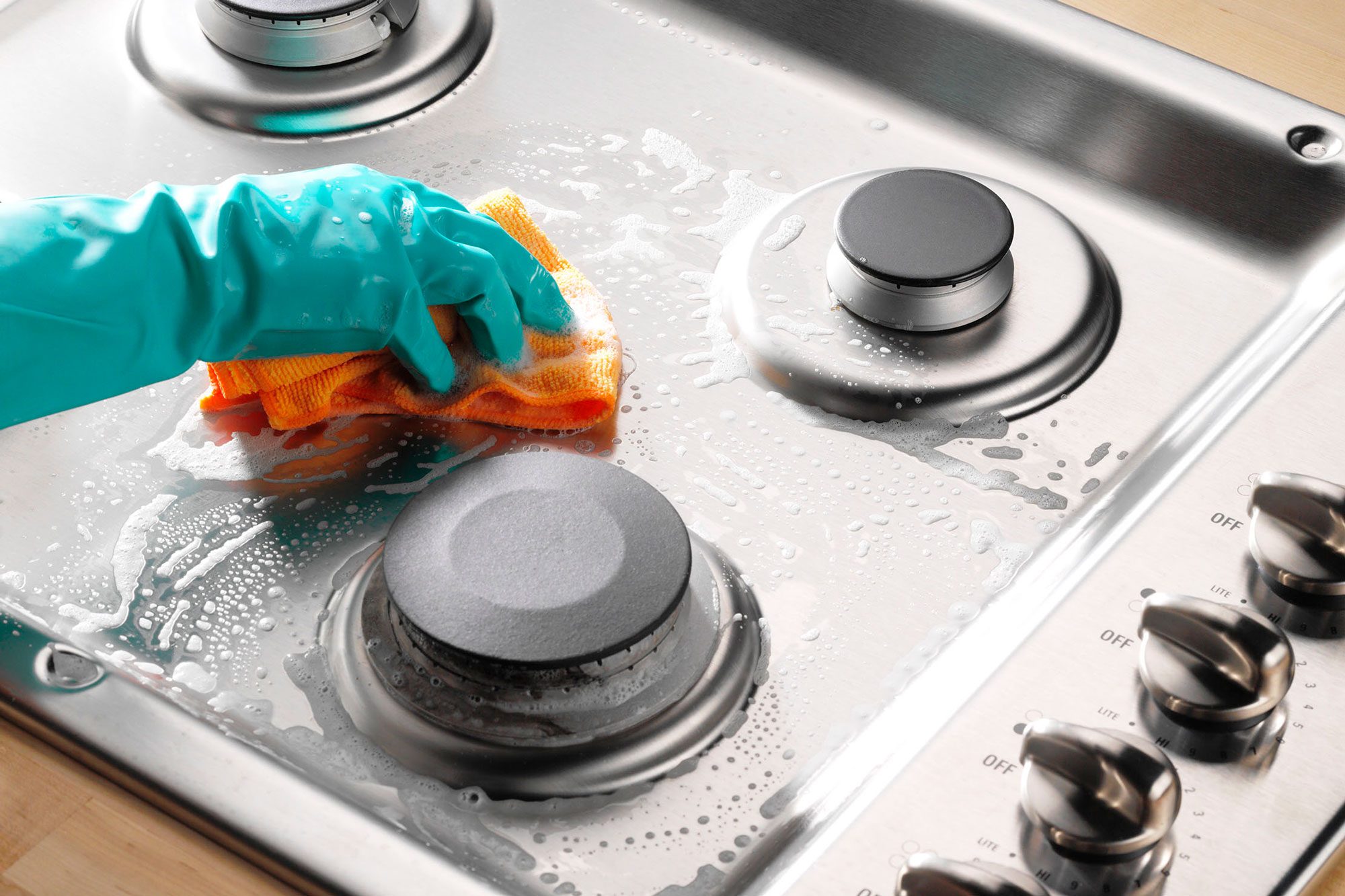 https://www.rd.com/wp-content/uploads/2023/03/How-to-Clean-a-Gas-Stovetop-RDDC2303_PU6207_P4onP2_MD_03_15_2b-scrub-the-surface.jpg?fit=680%2C454