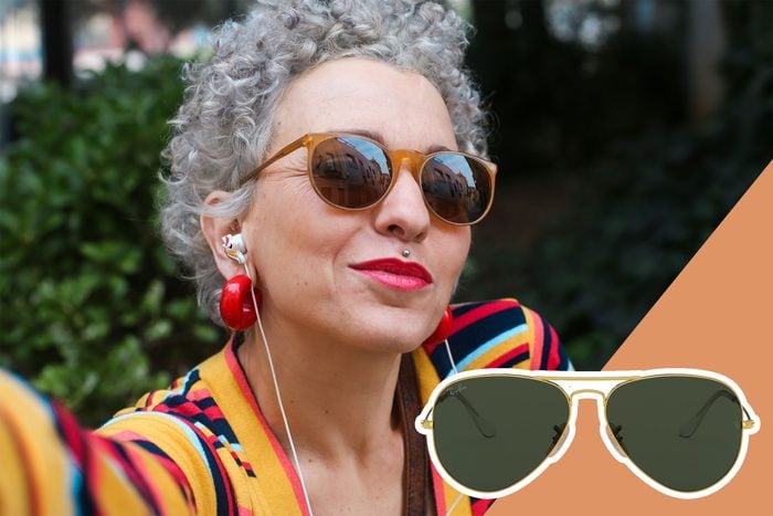 mature woman wearing sunglasses and a colorful shirt