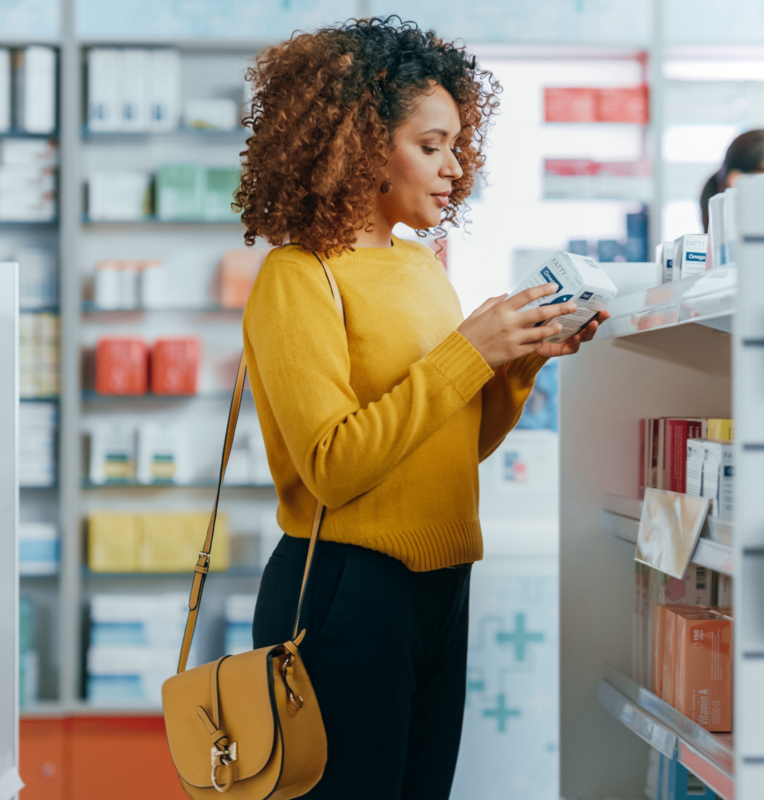 woman shops in pharmacy