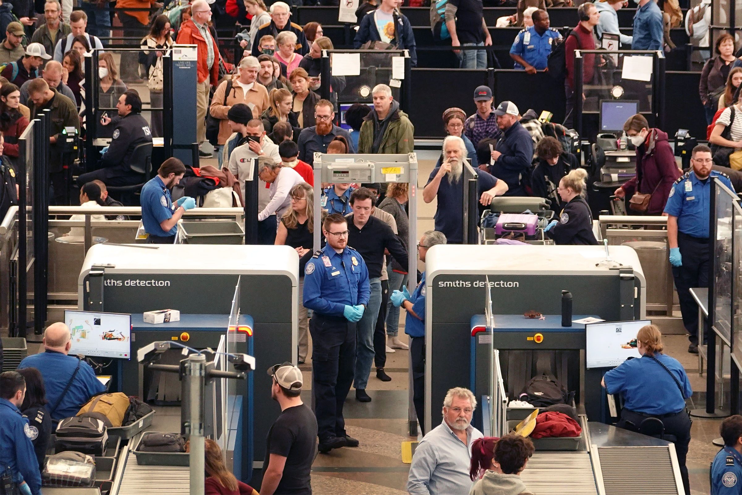 Travelers at the security checkpoint at Denver International Airport