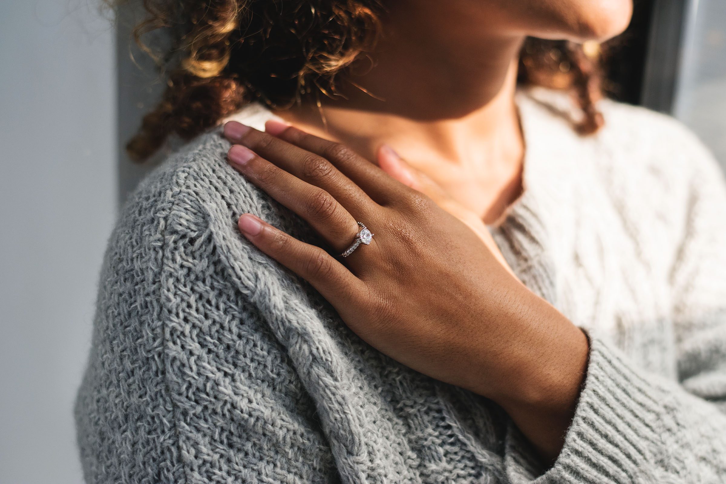 Woman wearing diamond engagment ring