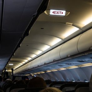 cabin lights and exit sign inside airplane