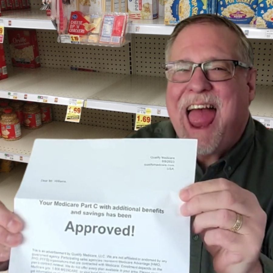 Smiling man with letter saying Medicare Part C benefits have been approved