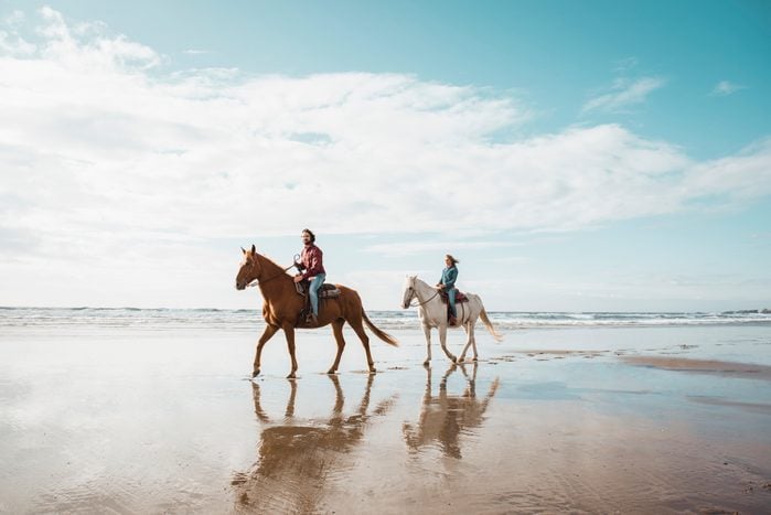 Couple Riding Horses