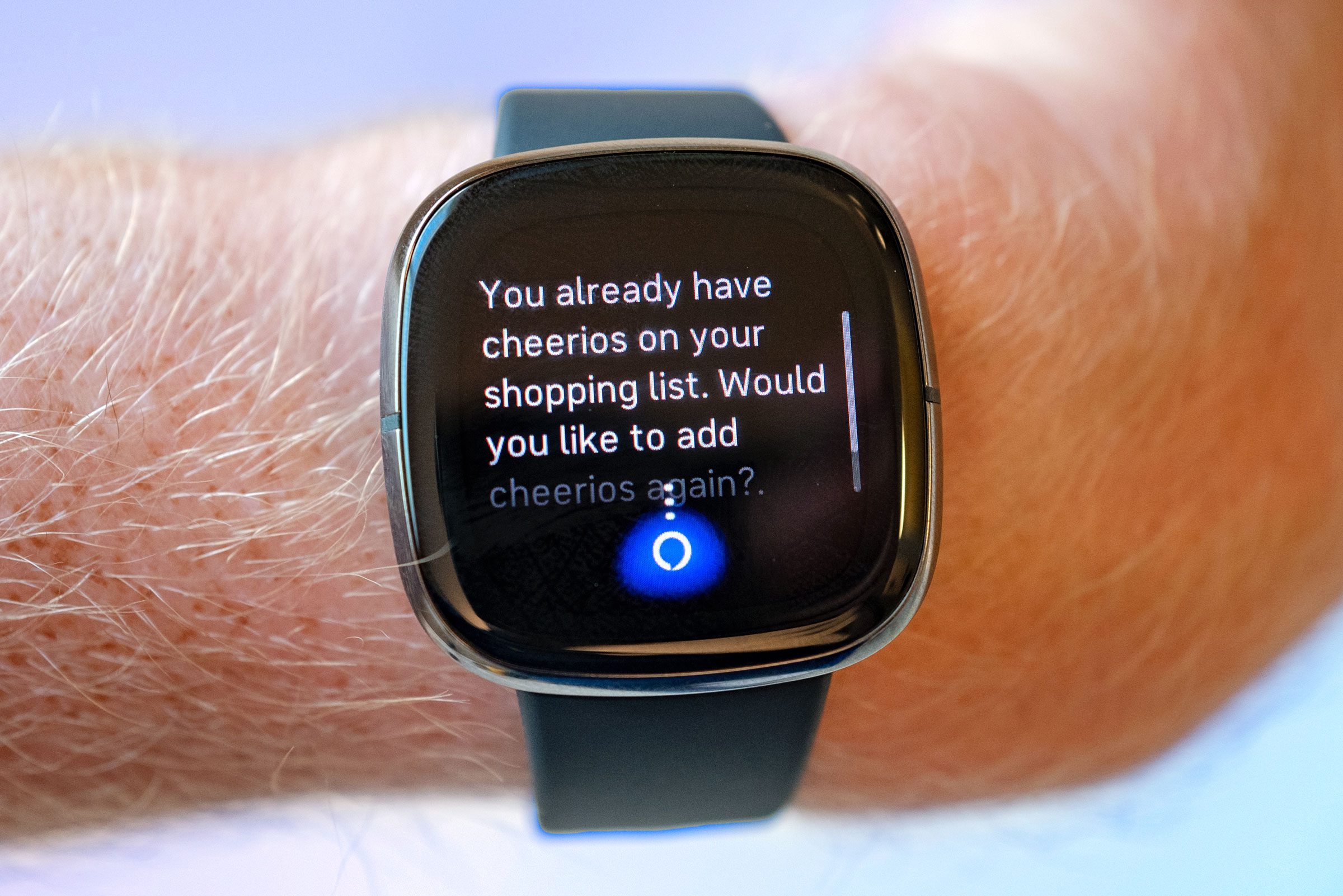 Man wearing a smart watch talking to Alexa about adding Cheerios to a shopping list