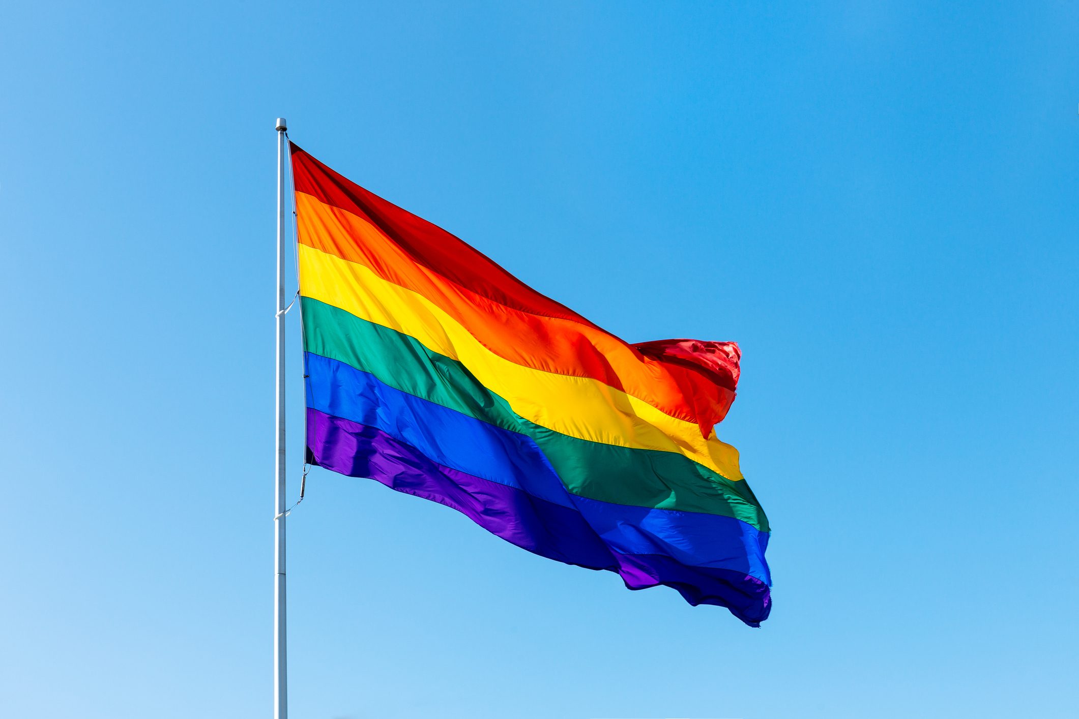 Rainbow LGBTQI flag waving in the wind