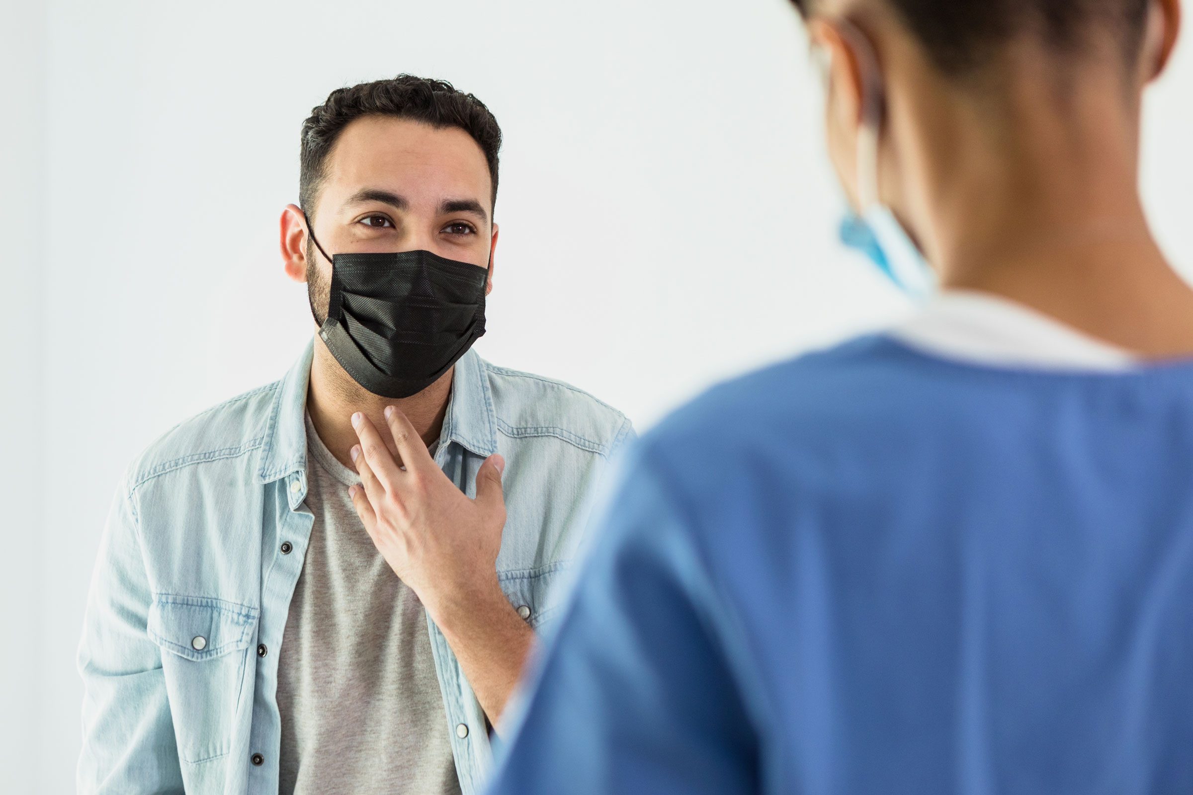 young man wearing a mask at the doctors